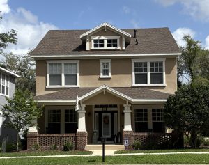 Craftsman-style home in FishHawk Ranch Garden District, Lithia FL — showcasing front porch charm, tree-lined streets, and walkable community living.