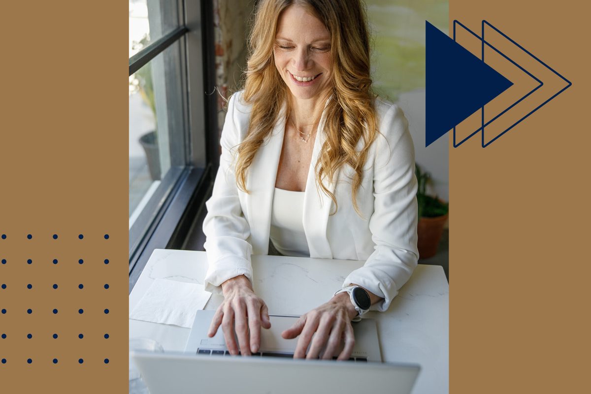 Professional real estate agent in a white blazer working on a laptop by a bright window, helping clients get mortgage pre-approved in FishHawk Ranch.