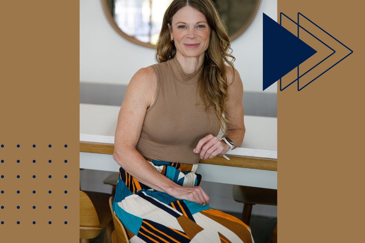 Real estate agent seated at a modern kitchen island, smiling confidently—representing professional guidance for selling your home in FishHawk Ranch